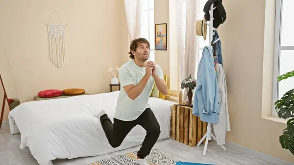 Casual Young Man Kneeling Bedroom Floor Looking Thoughtful Comfortable Well — Stock Photo, Image