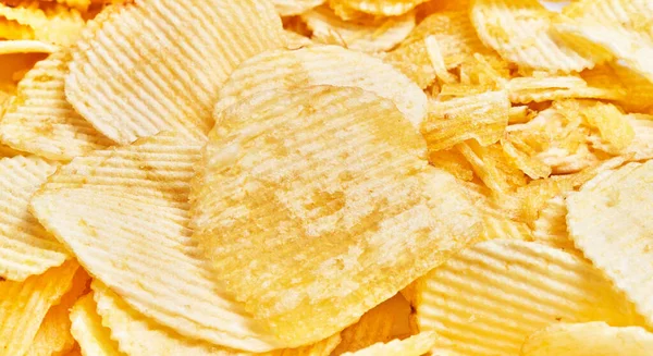 Close Crisp Textured Potato Chips Piled Together Emphasizing Concept Snacking — Stock Photo, Image