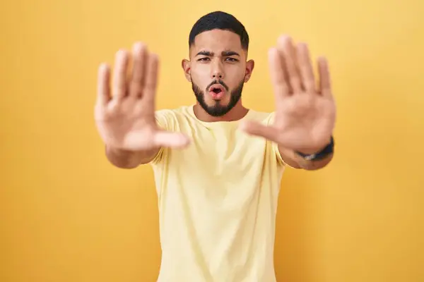 Young Hispanic Man Standing Yellow Background Doing Stop Gesture Hands — Stock Photo, Image
