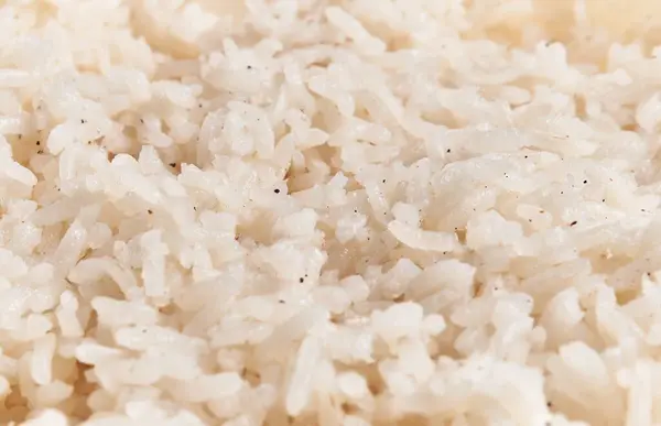 Close View Cooked White Rice Grains Seasoned Specks Black Pepper — Stock Photo, Image