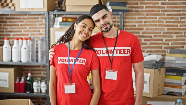 Smiling Man Woman Volunteers Enjoy Hugging Each Other Standing Charity — Stock Photo, Image