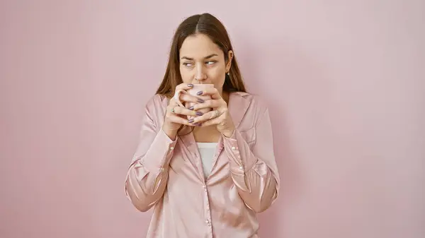Contemplative Young Woman Sips Mug Pink Room Expressing Calmness — Stock Photo, Image