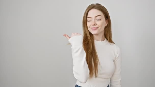 Young Blonde Woman Wearing Sweater Standing Pointing Thumb Side Smiling — Stock Video