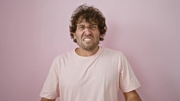 Young Hispanic Man Curly Hair Expressing Frustration Screaming Pink Isolated — Stock Video