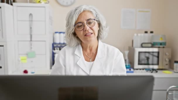 Mature Woman Scientist White Lab Coat Using Laptop Laboratory Setting — Stock Video
