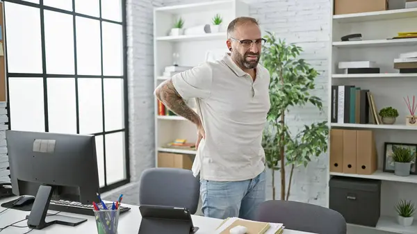 Unhappy Young Man Worker Suffering Backache While Standing Indoors Office — Stock Photo, Image