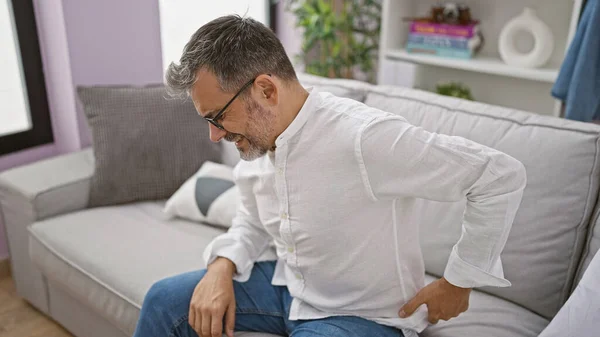 Worried Young Hispanic Man Grey Hair Suffering Severe Backache Sitting — Stock Photo, Image