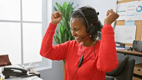 African American Woman Celebrates Joy Her Office Wearing Headset Red — Stock Photo, Image