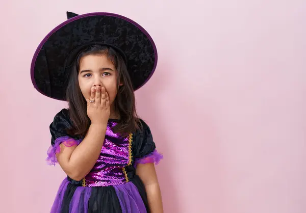 Adorable Hispanic Girl Witch Costume Covers Mouth Shock Afraid Surprised — Stock Photo, Image