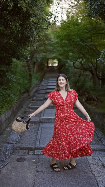 Glowing hispanic woman, radiating beauty, spins around in a traditional dress on gion kyoto\'s cobbled streets, igniting the old japanese town with infectious cheerfulness