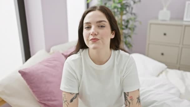 Cheerful Young Woman Pyjamas Proudly Points Self Bed Exuding Confidence — Stock Video