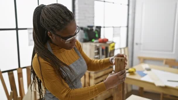 Confident Female Carpenter Braids Wearing Glasses Smiles While Sanding Wood — Stock Video