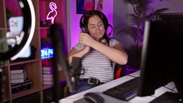 Young Woman Enjoys Gaming Vibrant Room Neon Lights Headphones Modern — Stock Video