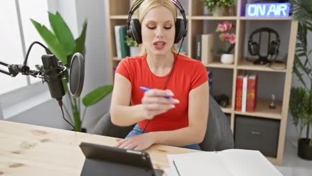 Focused Young Woman Headphones Sits Wooden Desk Modern Radio Studio — Stock Video
