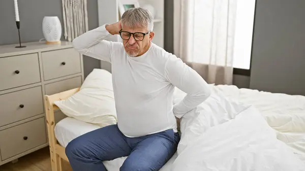 Grey Haired Man Pain Holding His Back While Sitting Bed — Stock Photo, Image
