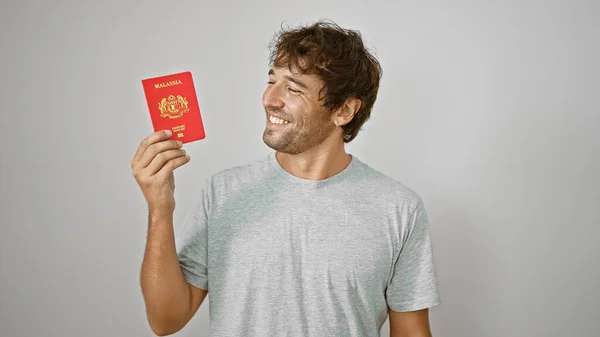 Confident Young Man Exuding Joy Proudly Flaunts His Malaysian Passport — Stock Photo, Image