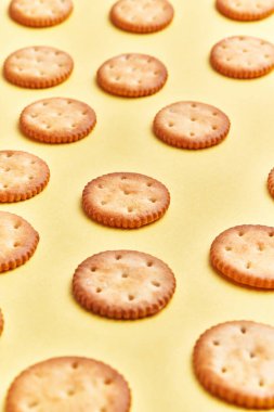  Delicious group of salty biscuits over isolated yellow background