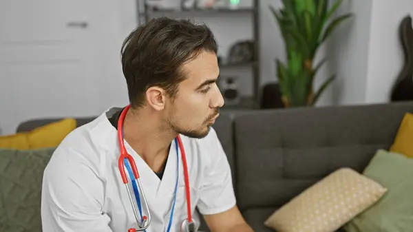 Young Hispanic Man Beard Wearing White Lab Coat Stethoscope Ponders — Stock Photo, Image