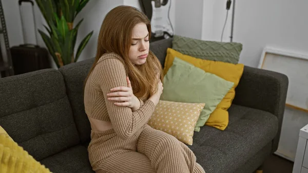 Young Caucasian Woman Feels Cold Home Sitting Couch Wrapped Beige — Stock Photo, Image