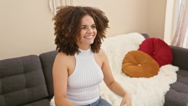 Excited Curly Haired Hispanic Woman Going Madly Joyful Home Sofa — Stock Video