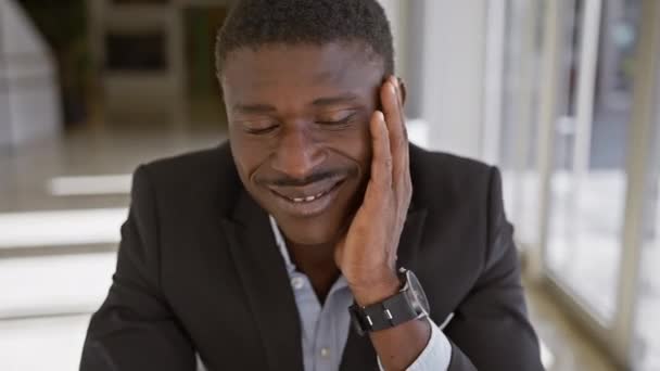 Thoughtful African Man Wearing Suit Poses Indoors Office Conveying Sense — Stock Video