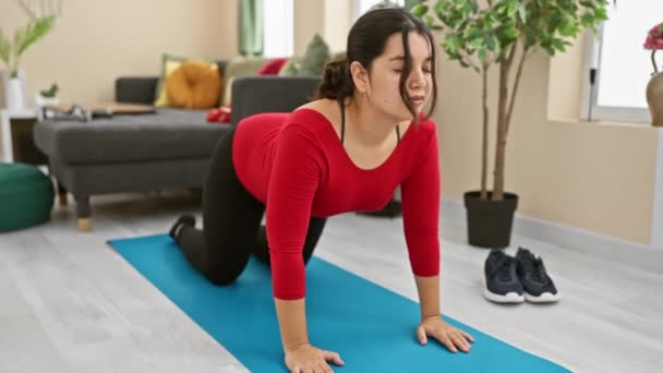 Hispanic Woman Exercises Yoga Mat Living Room Portraying Fitness Wellness Royalty Free Stock Video