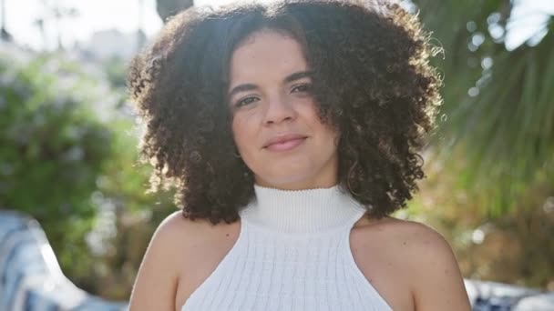 Smiling Young Hispanic Woman Curly Hair Enjoys Summer Sunlit Urban — Stock Video
