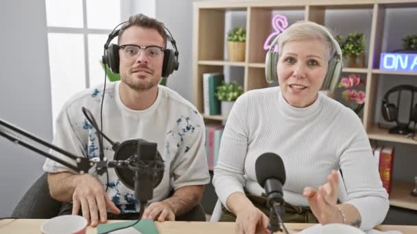 Man Woman Headphones Speaking Microphones Modern Podcast Studio Smiling Camera — Stock Video