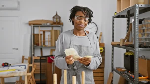 Smiling African Woman Counting Danish Currency Carpentry Workshop — Stock Video