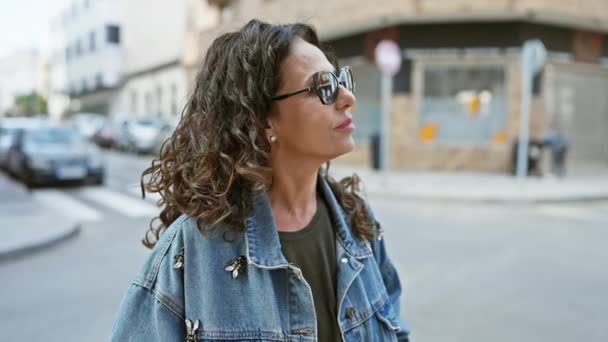 Confident Middle Aged Woman Curly Hair Wearing Sunglasses Denim Jacket — Stock Video