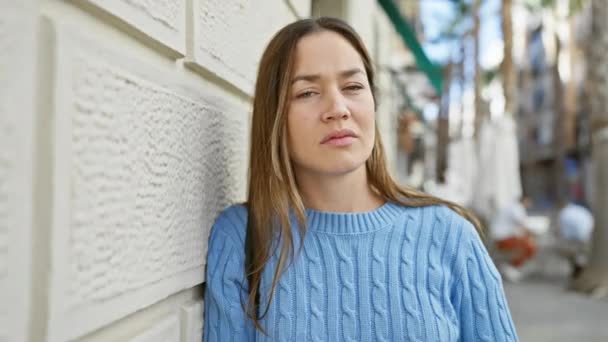 Contemplative Woman Long Brunette Hair Wearing Blue Sweater Stands Urban — Stock Video