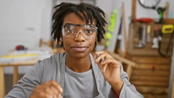 Smiling African American Woman Dreadlocks Wearing Safety Goggles Workshop — Stock Video