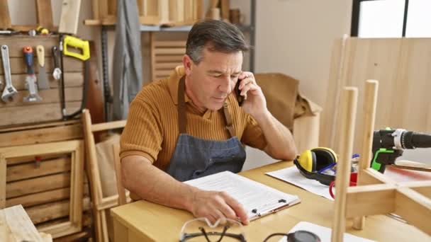 Middle Aged Man Phone Reviewing Documents Carpentry Workshop Tools Him — Stock Video
