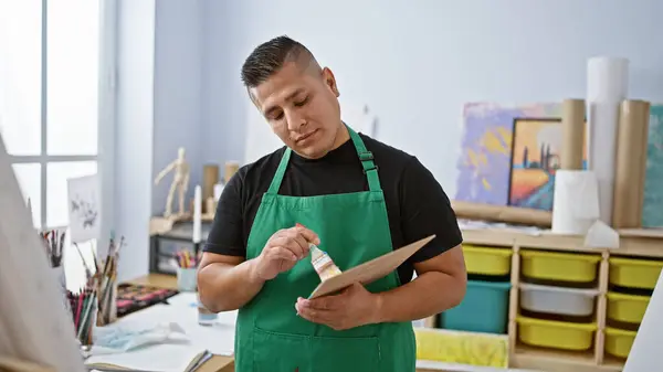 Handsome Latin Artist His Apron Earnestly Immersed His Art Holding — Stock Photo, Image