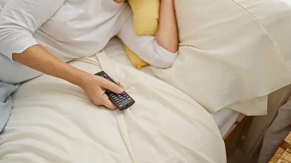 Cropped Image Middle Aged Woman Holding Remote Control While Lying — Stock Photo, Image