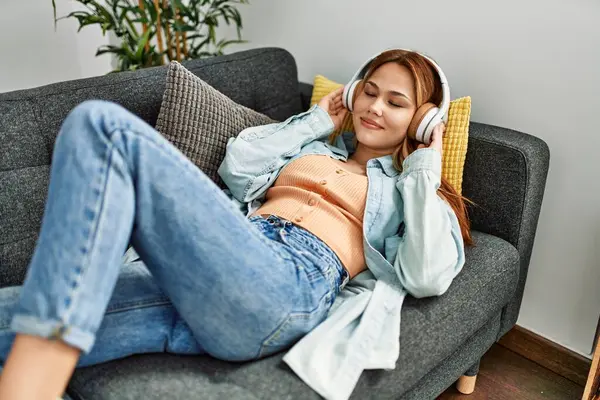 Young Caucasian Woman Listening Music Lying Sofa Home — 图库照片
