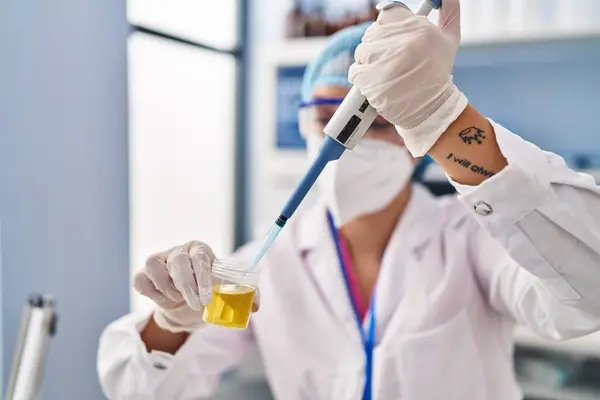 Young Beautiful Hispanic Woman Scientist Pouring Liquid Urine Test Tube — Stock Photo, Image
