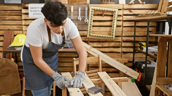 Young Adult Man Sanding Wood Well Organized Carpentry Workshop Showcasing — Stock Photo, Image