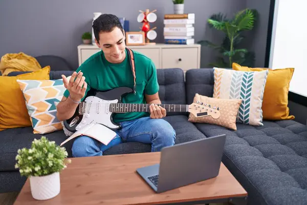 Young Hispanic Man Having Online Electrical Guitar Class Sitting Sofa — Stock Photo, Image