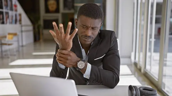 Handsome Black Man Pain Holding Wrist Modern Office Interior — Stock Photo, Image