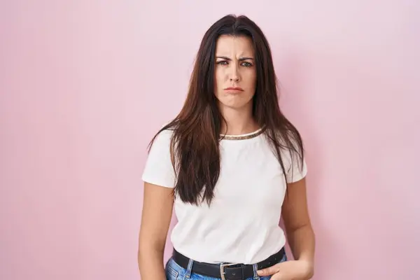 Young Brunette Woman Standing Pink Background Skeptic Nervous Frowning Upset — Stock Photo, Image