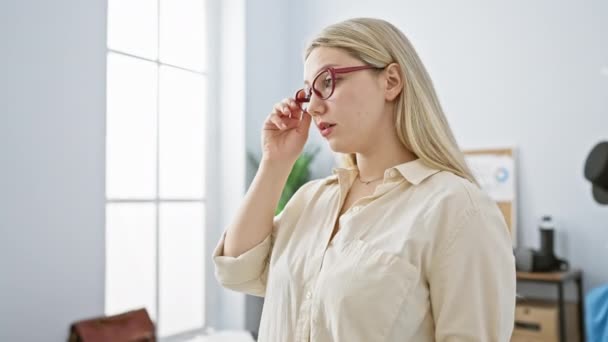 Fatigued Young Woman Office Setting Holds Her Glasses Embodying Workplace — Stock Video