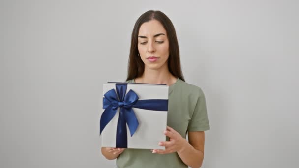Confident Young Hispanic Woman Looking Serious Contemplating Gift Package Standing — Stock Video