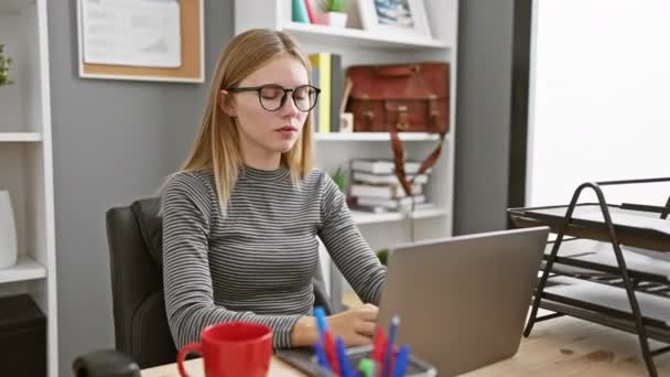 Professional Blonde Woman Wearing Glasses Office Setting Working Laptop Emotion — Stock Video