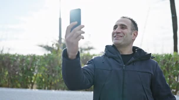 Smiling Man Using Smartphone Video Call Outdoors Park — Stock Video