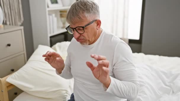 Grey Haired Middle Age Man Wearing Pyjama Showing Disgusted Face — Stock Video