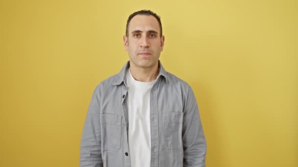 Young Hispanic Man Wearing Shirt Standing Peeking Shock Covering Face — Stock Video