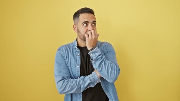 Anxious Young Hispanic Man Denim Shirt Biting Nails Nervously Wallowing — Stock Video