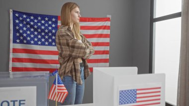 Young caucasian woman with arms crossed in a casual outfit standing contemplatively in a voting booth with american flags. clipart