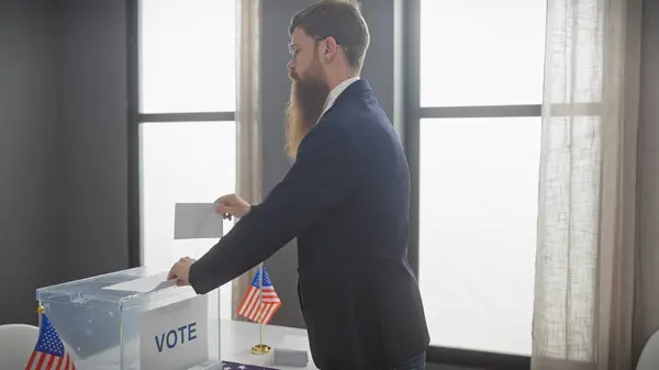 Bearded Man Suit Casting Ballot American Election Indoors Flags — Stock Photo, Image